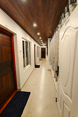 Corridor – Hornbill Castle Homestay Valparai Peaceful indoor corridor at Hornbill Castle